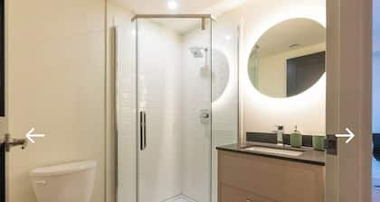 Modern 2-Bedroom Retreat Near Universities | Gym, Sauna & Theater