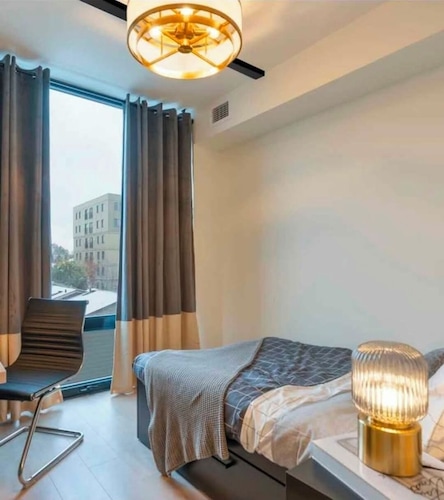 Modern 2-Bedroom Retreat Near Universities | Gym, Sauna & Theater