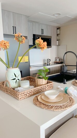 Fridge, microwave, stovetop, coffee/tea maker