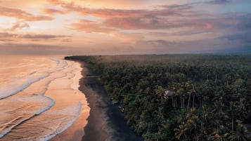 On the beach, black sand