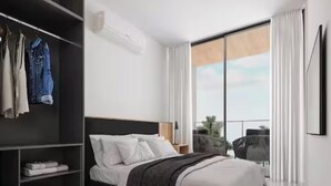 A modern hotel room with a large bed, a wardrobe, a balcony with a view, and a flat-screen TV. - Porto 2 Life Resort (Ipojuca)