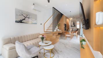 Executive Villa | Living area | 45-inch Smart TV with satellite channels