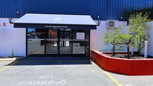 The entrance to Gallery Boutique Hotel with a clear "No Parking" sign and a fire hydrant visible. - Gallery Boutique Hotel (Bibra Lake)