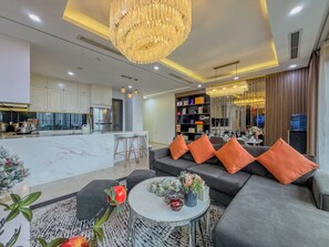 Standard Apartment, 3 Bedrooms, 2 Bathrooms, City View | Living area | Fireplace, heated floors - Hermes Housing - Vinhomes D'Capitale (Cau Giay)