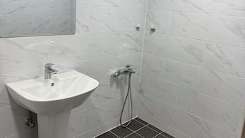 Basic Double Room, 1 Queen Bed, Non Smoking, Air conditioning | Bathroom | Shower, hair dryer, towels, soap