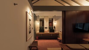 A modern bathroom with a large mirror, dual sinks, and a wooden vanity. - Brown Feather Pererenan (Pererenan)