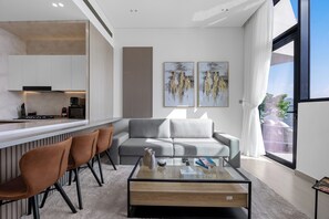 Living area - Chic 1BR Retreat with Pool & Balcony JVC (Madinat Zayed)