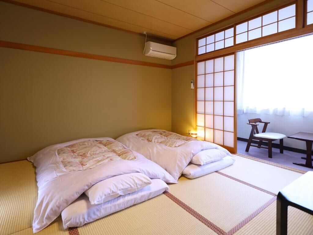 Standard Quadruple Room, Private Bathroom | In-room safe, desk, free WiFi