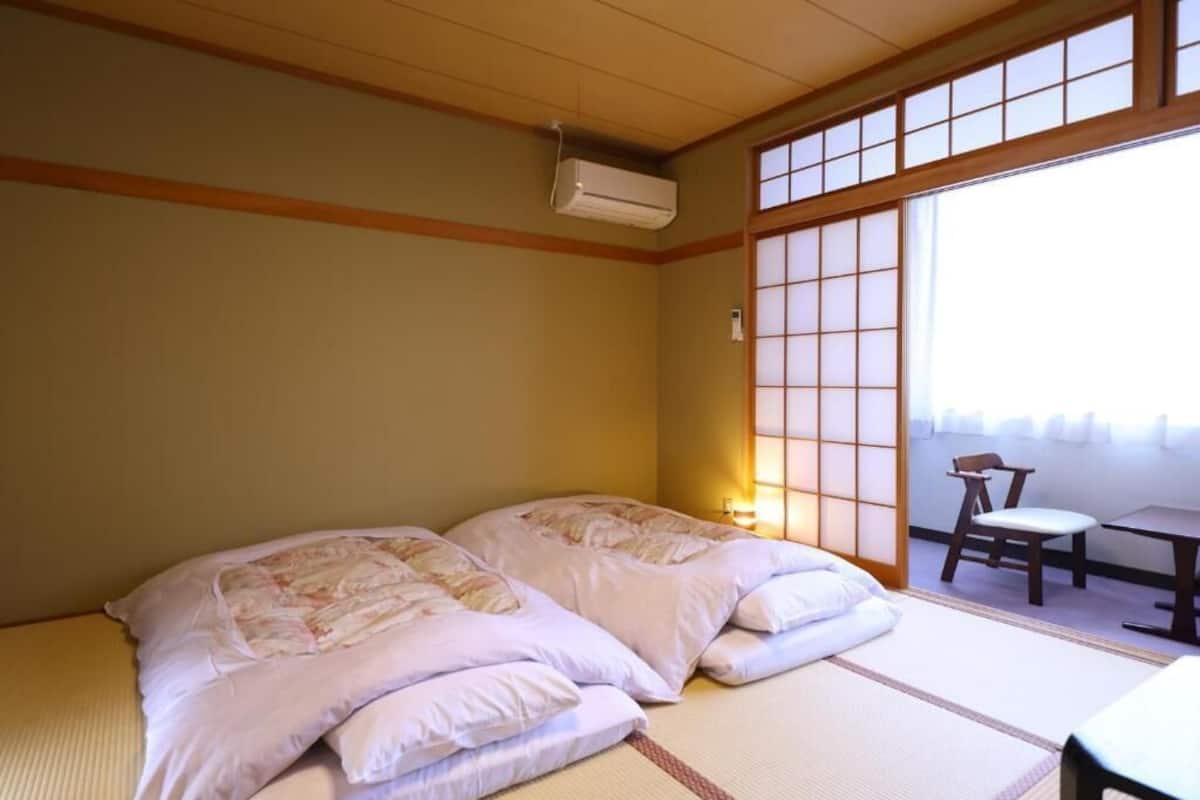 Standard Quadruple Room, Private Bathroom | In-room safe, desk, free WiFi