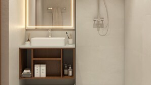 A modern bathroom with a large mirror, a white sink, and a shower. - Asaya Kata (Karon)