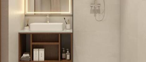 A modern bathroom with a glass shower enclosure, a white sink, and a mirror with integrated lighting.