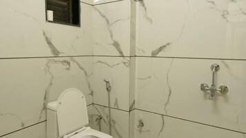 Deluxe Double Room, City View | Bathroom | Shower, free toiletries, hair dryer, slippers