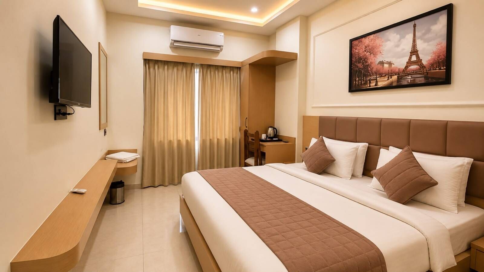 A hotel room with a bed, a desk, a chair, a TV, an air conditioner, and a painting of the Eiffel Tower.