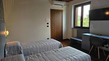 Camera con letto matrimoniale o 2 letti singoli, vista giardino | Wi-Fi gratuito