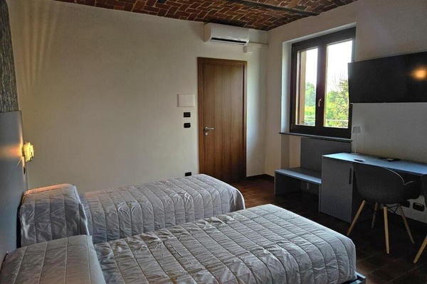 Kamer, 1 twee- of 2 eenpersoonsbedden, uitzicht op tuin | Gratis wifi