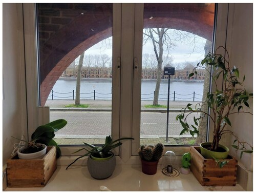 Spacious 4-bedroom townhome in serene London with AC in two rooms