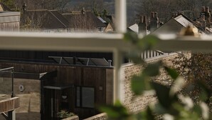 A view from a window overlooking a rural landscape with houses and trees. - King William Pub with Rooms (Bath)