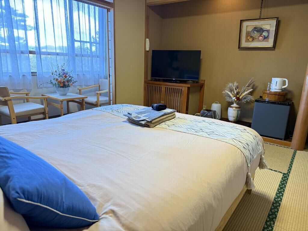 Deluxe Double Room, Garden View | Free minibar items, in-room safe, individually decorated, free WiFi