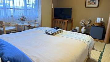 Deluxe Double Room, Garden View | Free minibar items, in-room safe, individually decorated, free WiFi