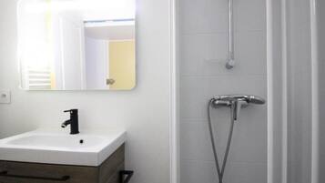 Shower, hair dryer, towels, toilet paper