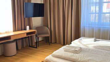 Desk, laptop workspace, blackout curtains, free WiFi