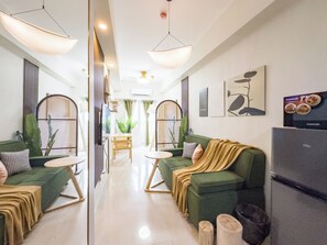 Design Condo, City View | Living area - GemstoneBR in SMDC Field Residences (Las Pinas)