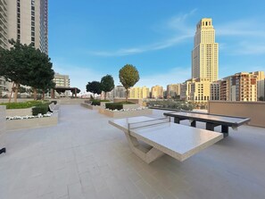 Outdoor dining - Serene 1BR Escape with Burj Khalifa View (Dubai)