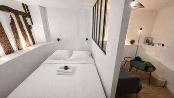 Tabla de planchar con plancha, wifi y ropa de cama