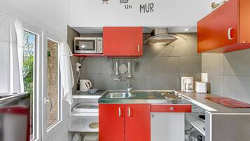 Fridge, microwave, stovetop, coffee/tea maker