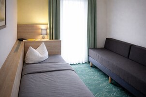 Habitación individual | Caja fuerte, sistema de insonorización, wifi gratis y ropa de cama