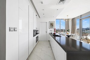 Apartment, Balcony, City View | Private kitchen - Refined 2BR Apartment District One MBR (Dubai)