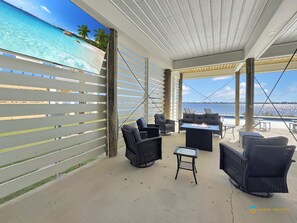 House, Multiple Beds, Pool Access (Bacon in the Sun) | Terrace/patio - Waterfront Luxury Home for 10 Pool Fireplace (Gulf Shores)