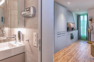 Twin Room | Bathroom | Shower, hair dryer, towels, soap