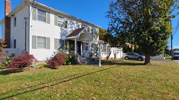A two-story house with a front porch and a garage.