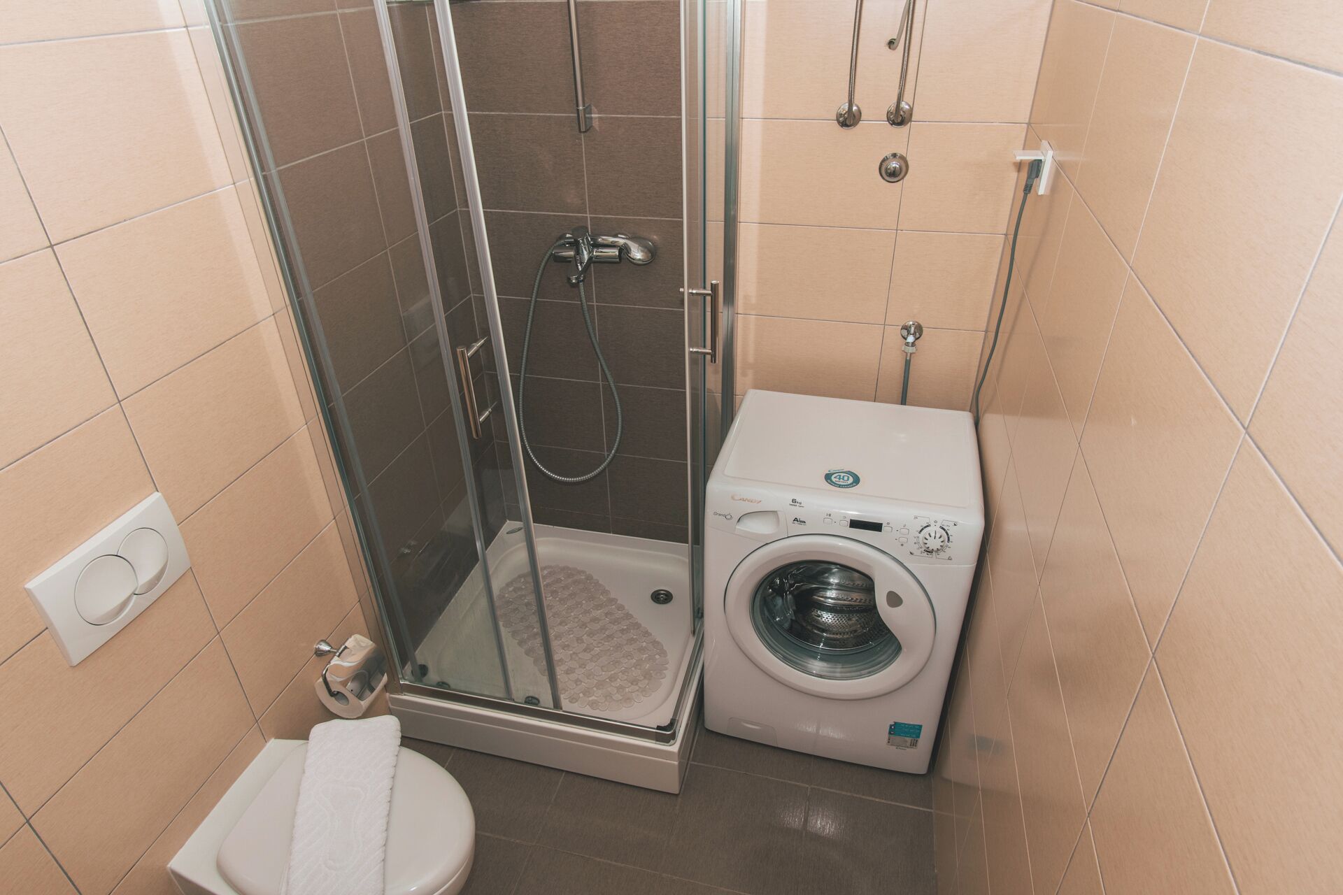 Shower, towels, soap, toilet paper