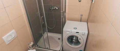 Shower, towels, soap, toilet paper