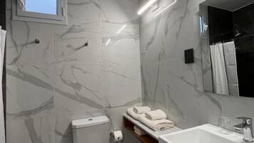 Standard Double Room | Bathroom | Shower, hair dryer, towels, soap