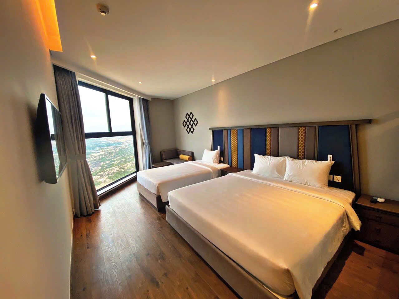 Chambre Junior Double ou avec lits jumeaux, vue plage | Coffres-forts dans les chambres, bureau