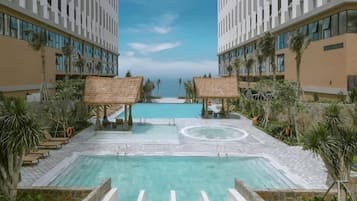 4 outdoor pools, open 8:00 AM to 8:00 PM, pool umbrellas, pool loungers