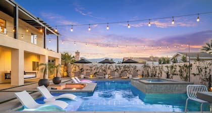 Spacious 6-bedroom desert home with a private pool, spa, and sunken firepit lounge. Features a fun game room, fully stocked kitchen, and open living spaces—ideal for groups looking to relax, gather, and enjoy the Coachella Valley.
