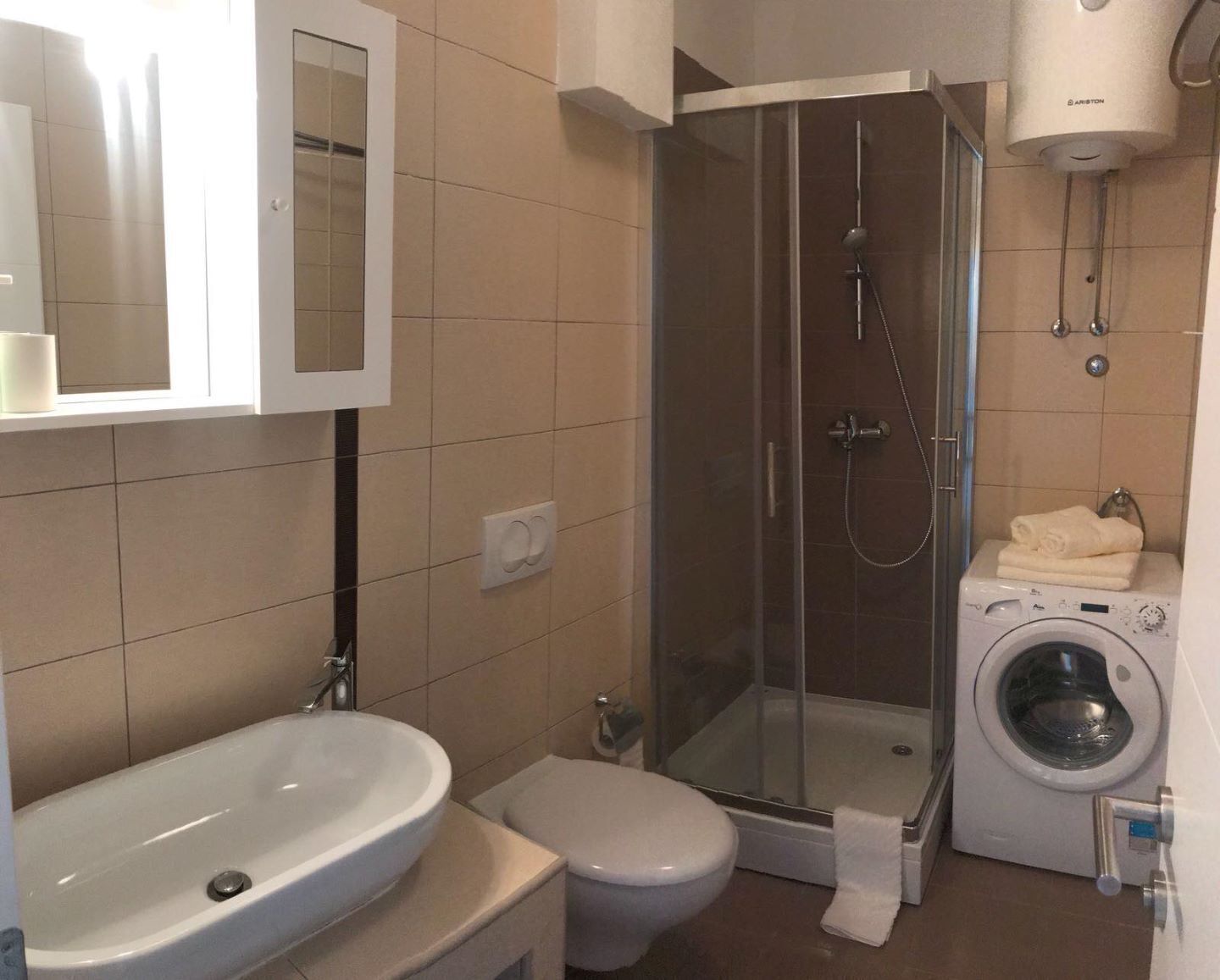 Shower, towels, soap, toilet paper