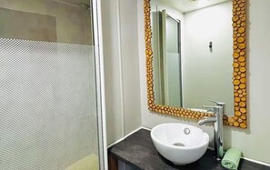 Shower, towels, soap, toilet paper