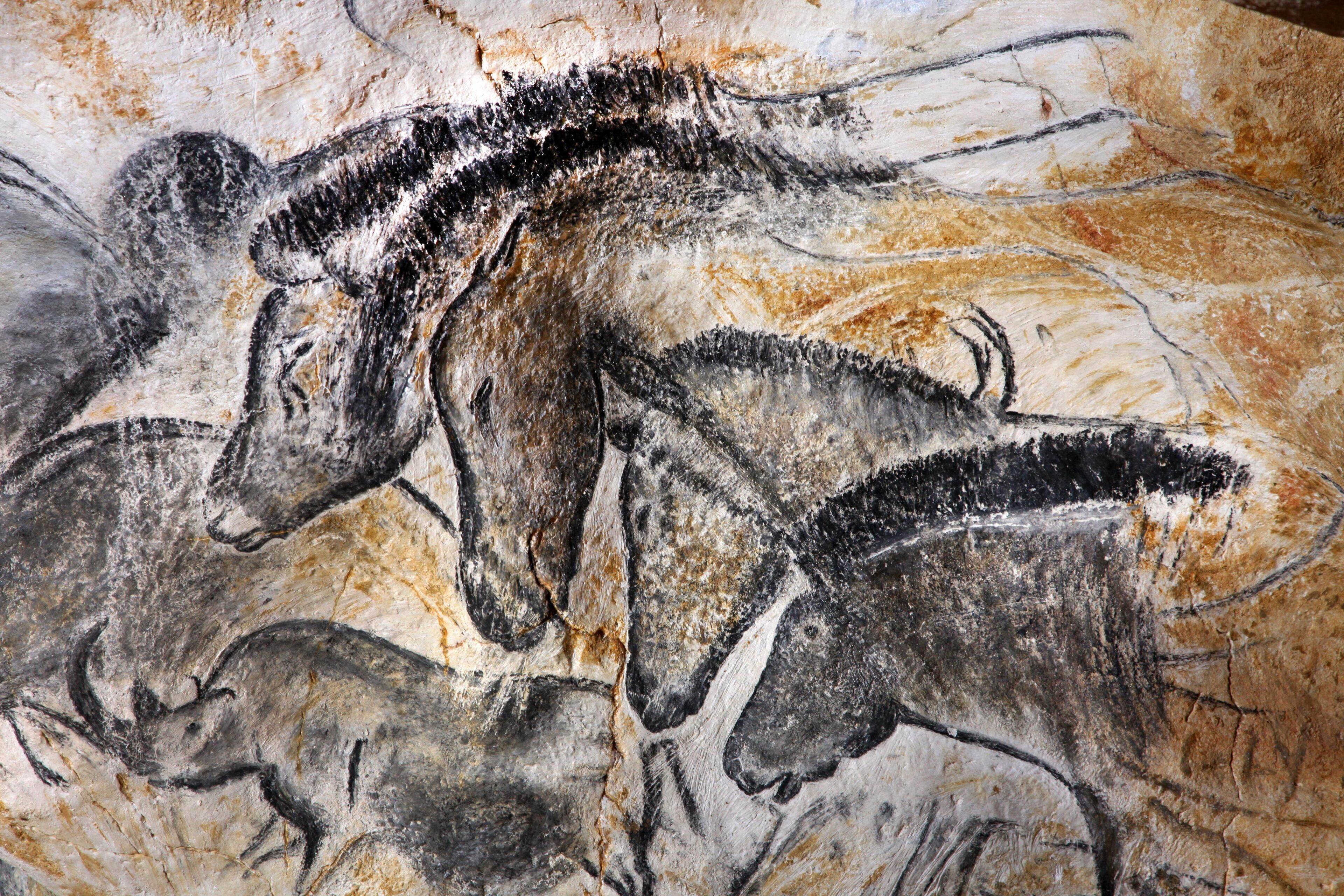 A cave painting of prehistoric animals.
