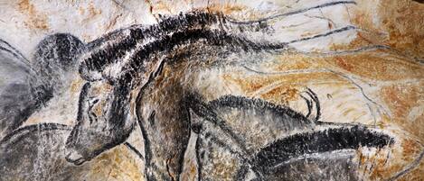 A cave painting of prehistoric animals.