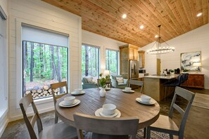 Dining - Welcome to Heaven’s Door a spacious, family-friendly retreat designed for comfort, connection, and fun. Enjoy soaring white pine ceilings, cozy living spaces, game-filled rooms, and a backyard built for memories with a hot tub and fire pit swings. (Broken Bow)