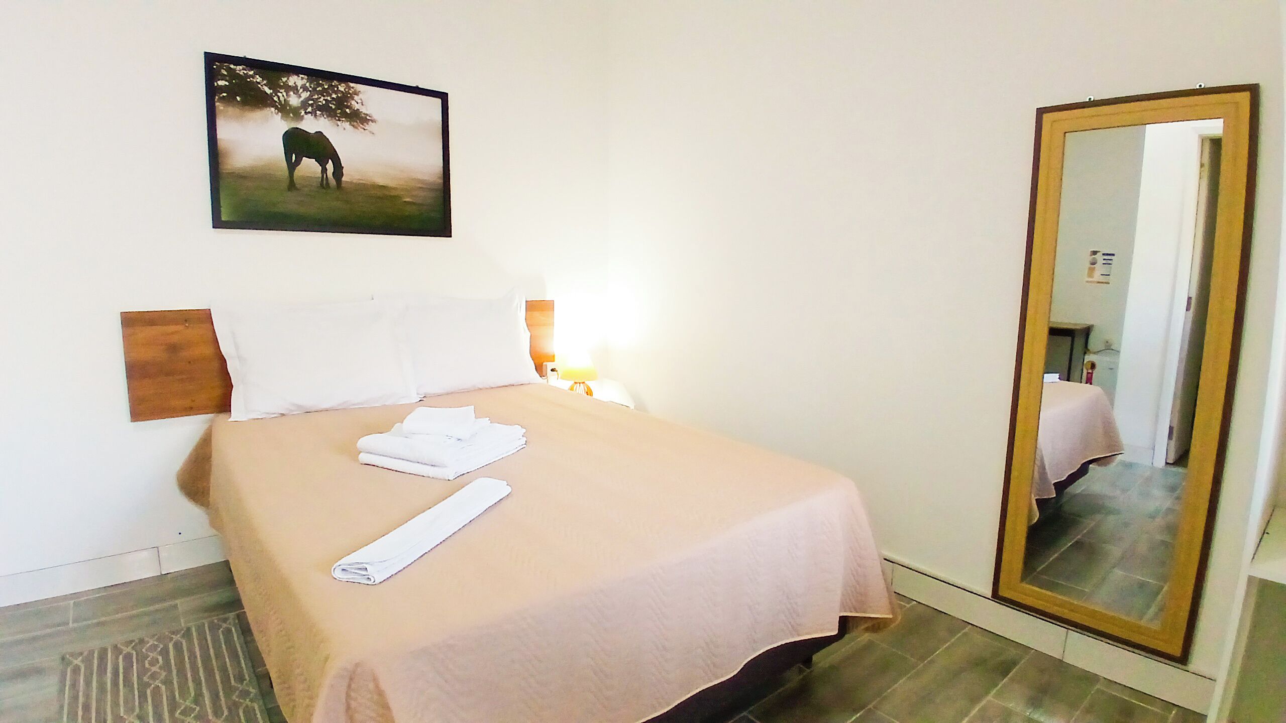 Double Room, Courtyard View | Pillow-top beds, iron/ironing board, free WiFi, bed sheets