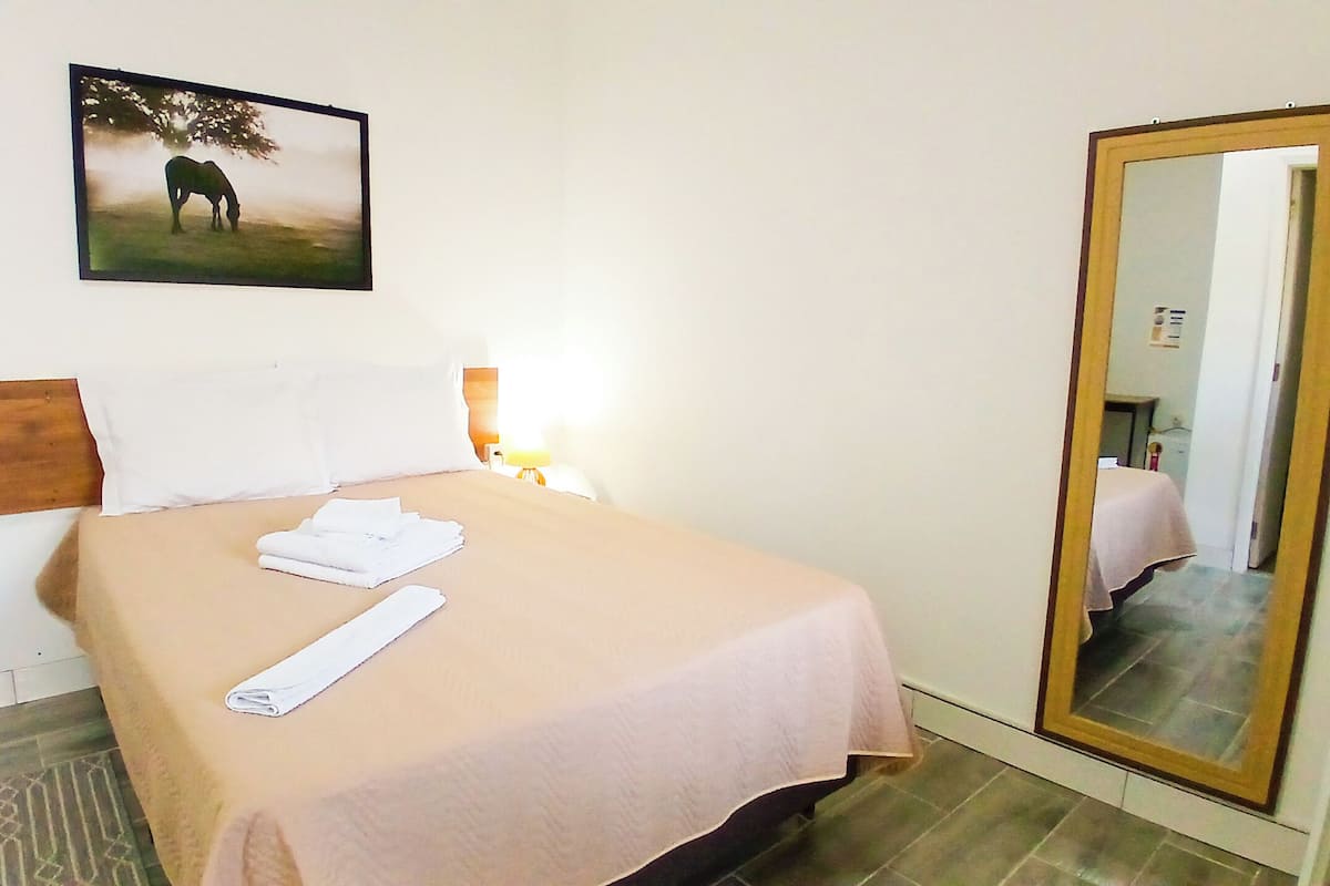 Double Room, Courtyard View | Pillow-top beds, iron/ironing board, free WiFi, bed sheets