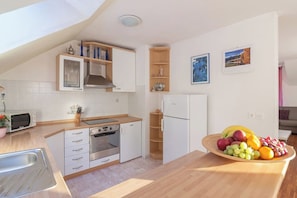 Private kitchen - Superior 2-Bedroom Apartment With 3 Balconies In The Lake Bled Area Of Slovenia (Moste)