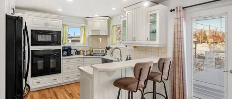 Fridge, microwave, stovetop, coffee/tea maker