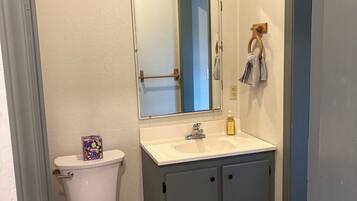 Shower, towels, soap, toilet paper